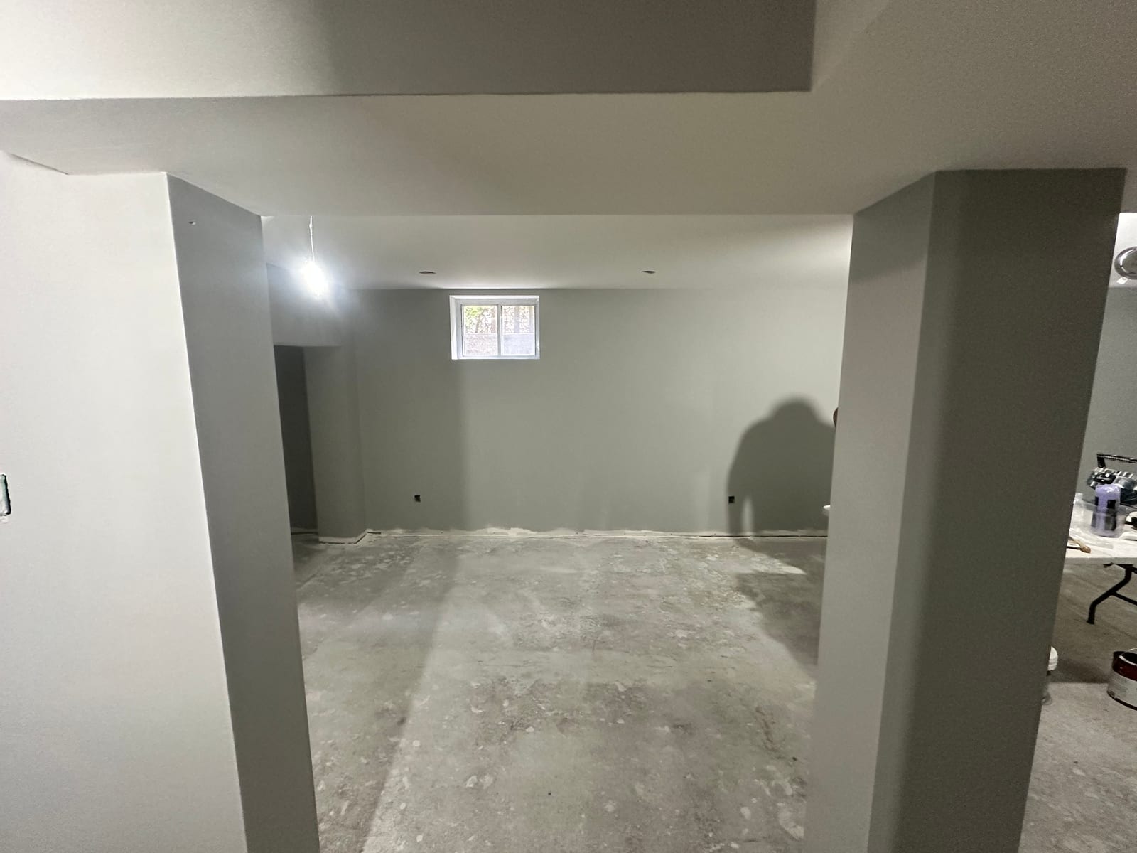 Finished grey walls and bulkheads viewed through framed opening